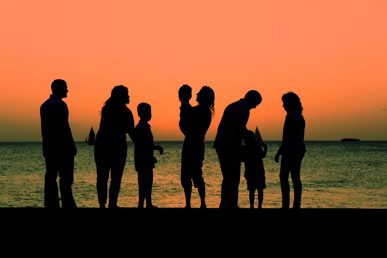 Multigenerational family watching the sunset